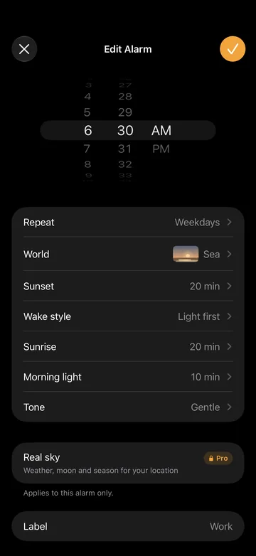 The alarm editor with time, weekdays, world, wake style, sunrise and tone.
